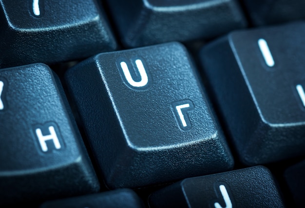 Photo electronic collection  detail black computer keyboard with russian letter focus on the center key