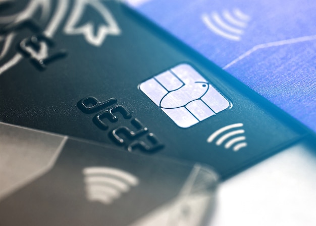 Photo electronic contactless credit card with selective focus microchip. macro of a credit card.