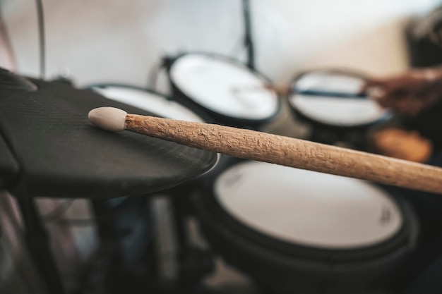 electronic drumsticks and drums on a dark background Playing the training drums