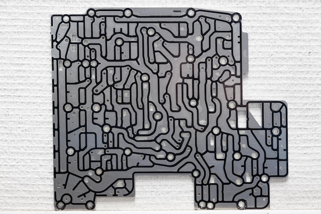 an electronic microcircuit with an aluminum board with black tracks for transmitting information and electrical signals in computers with modern technologies
