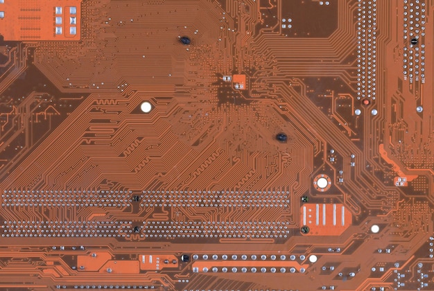 Electronic microcircuit with microchips and capacitors closeup macro