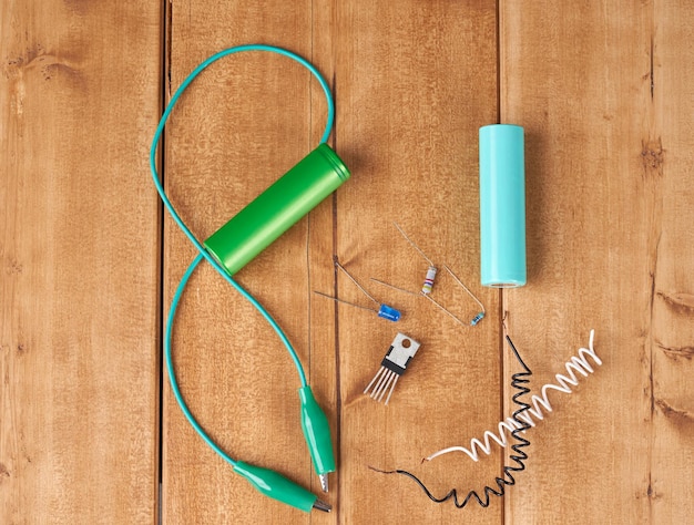 Electronic parts on wooden table.