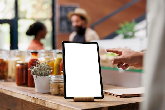 Electronic tablet on a table in eco store