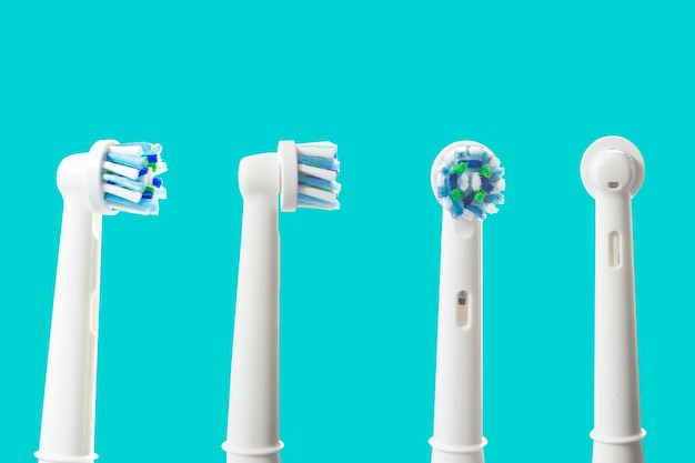 Electronic toothbrush isolated on blue background