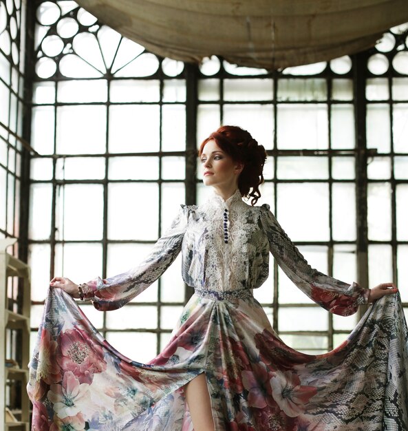 Elegance woman with flying dress in palace room