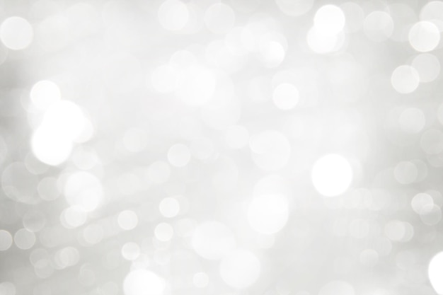 Elegant Abstract Silver Christmas Background with white bokeh lights for Holiday Poster, Banner, Ad,