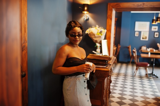 Elegant African American woman in a bar