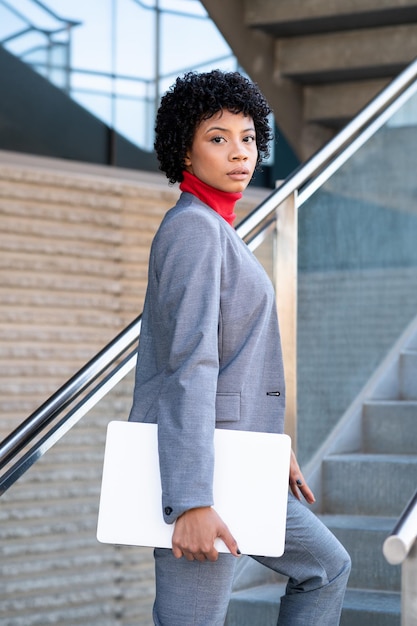An elegant African American woman working in an office building