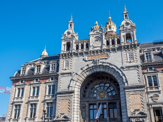 Elegant beautiful design at front of Antwerp train station in Belgium under blue sky