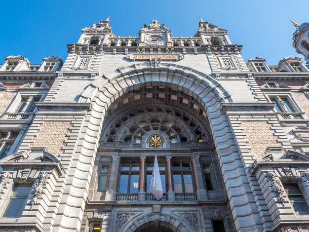 Elegant beautiful design at front of Antwerp train station in Belgium under blue sky