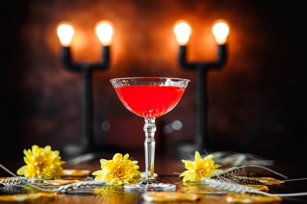 Elegant berry cocktail on decorated background