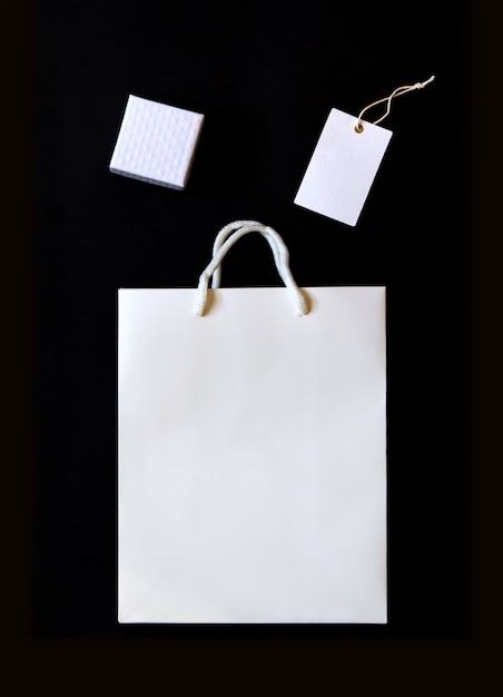 Elegant black and white shopping  with paper bag and box and label