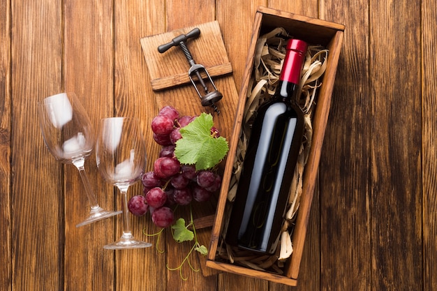 Photo elegant bottle of red wine with glasses