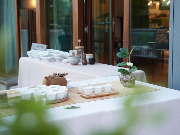 Elegant break at events Tables with outdoor tea service teapot and white cups