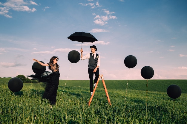 Elegant bride and groom posing together outdoors on a wedding day