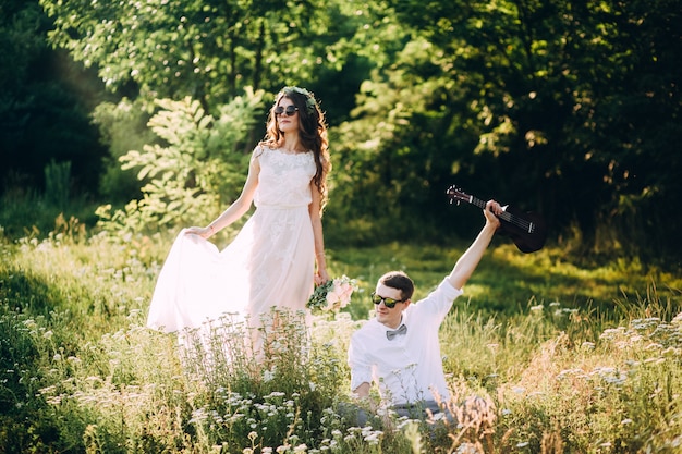 Elegant bride and groom posing together outdoors on a wedding day