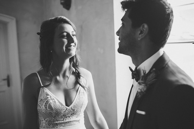 Elegant bride and groom posing together outdoors