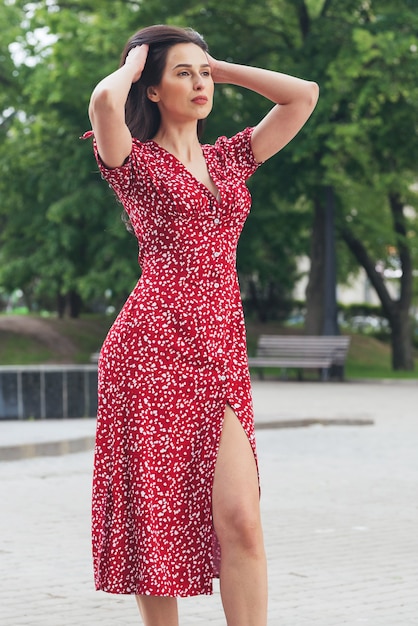 elegant brunette girl posing at city street Pretty beautiful business woman in elegant dress