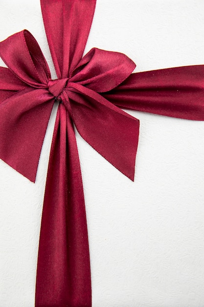 Elegant burgundy ribbon on white background