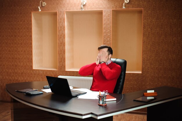 Elegant businessman analyzing data in the office.