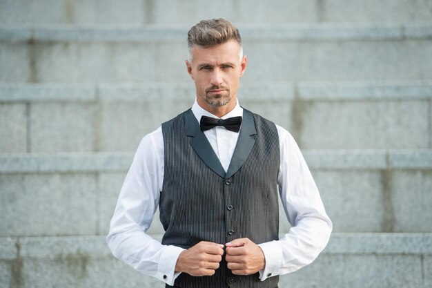 Elegant businessman in bowtie grizzled businessman in formalwear businessman in suit male fashion