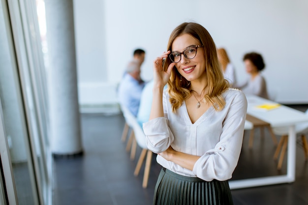 Elegant businesswoman standing in office