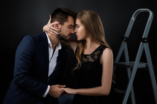 Elegant couple on black background