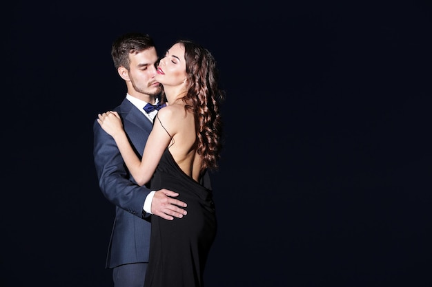 Elegant couple on dark background