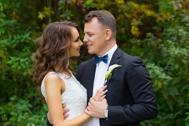 Elegant curly bride and stylish groom