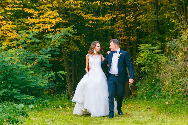 Elegant curly bride and stylish groom