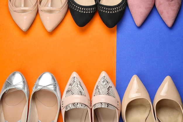 Elegant female shoes on color 