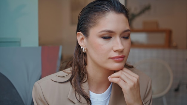 Elegant freelancer resting cafe looking camera confidently closeup portrait
