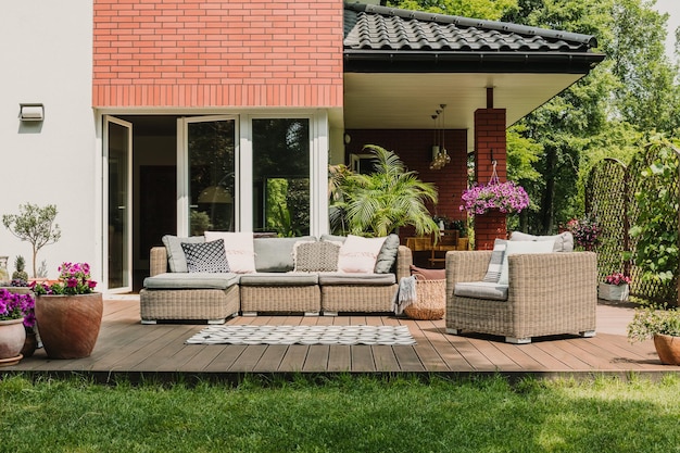 Elegant garden furniture on terrace of suburban home