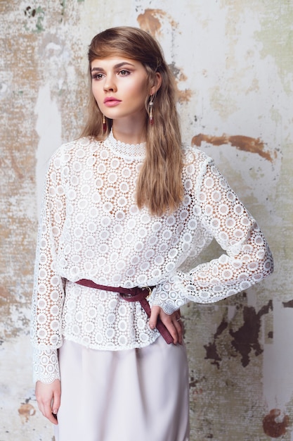 Elegant girl wearing white lace blouse