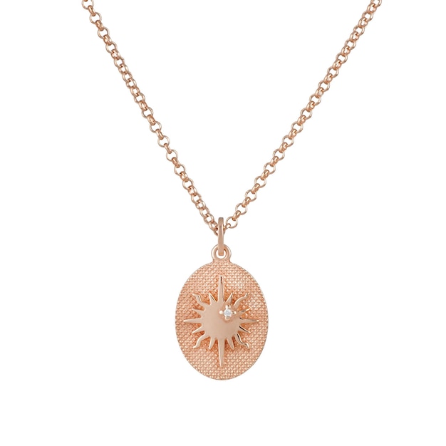 Elegant gold pendant on a chain on a white background