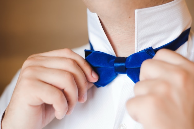 Elegant groom dressing in a wedding suit