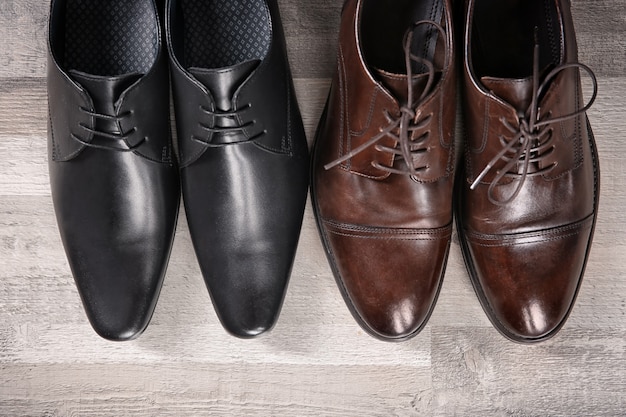 Elegant leather men's shoes on floor, top view