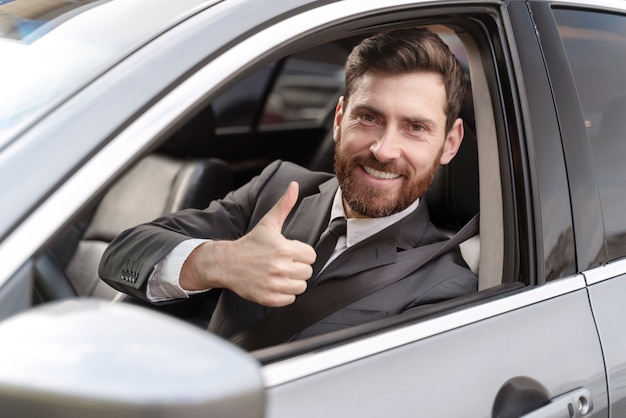 Elegant male taxi driver in costume