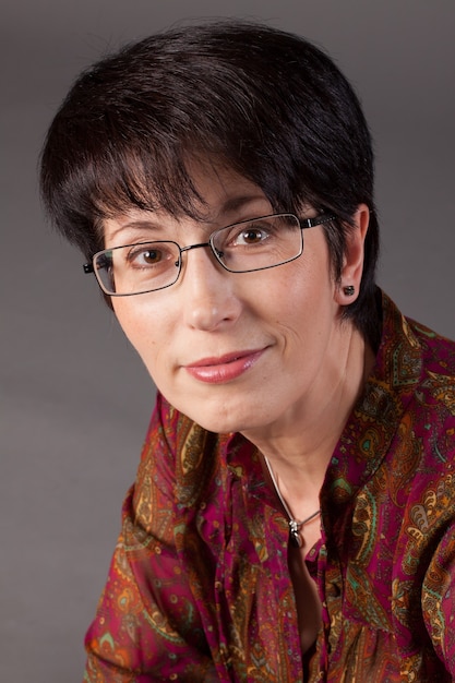 Elegant middle-aged woman with eyeglasses
