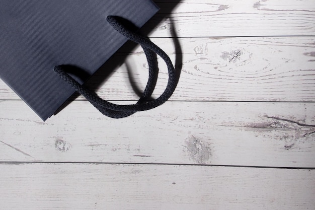 Elegant paper bag on white wood