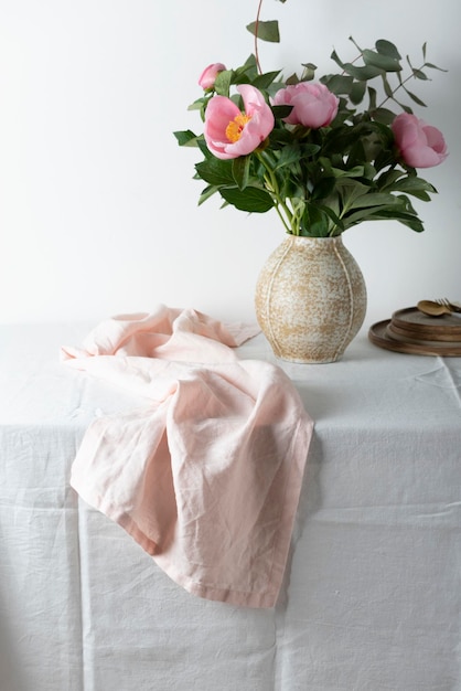 Elegant pink linen runner on the white tablecloth