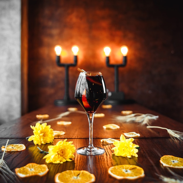 Elegant red wine cocktail on decorated table