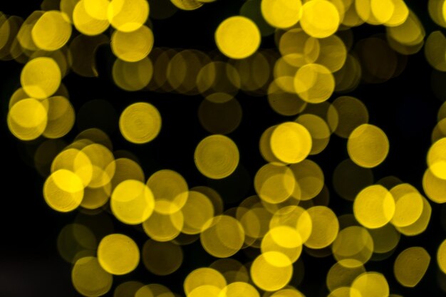 Foto fondo dorato delle luci di natale elegante e romantico con bokeh