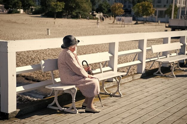 Elegant senior woman on bench