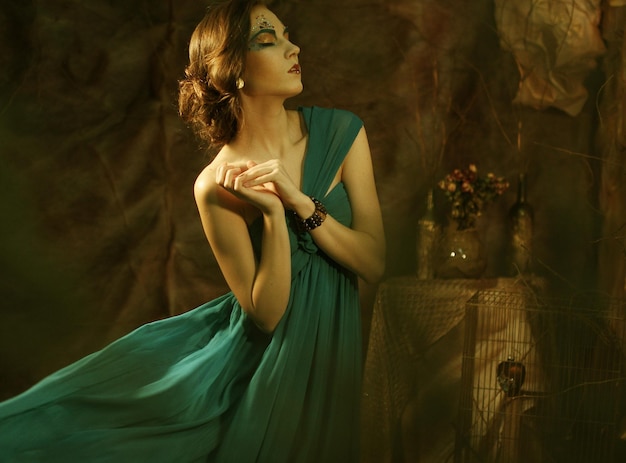 Elegant sensual young woman in blue dress