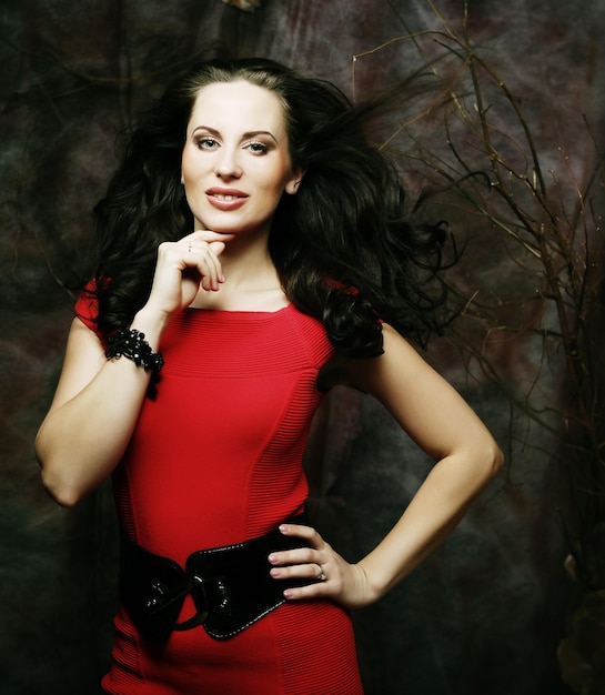 Elegant sensual young woman in red dress