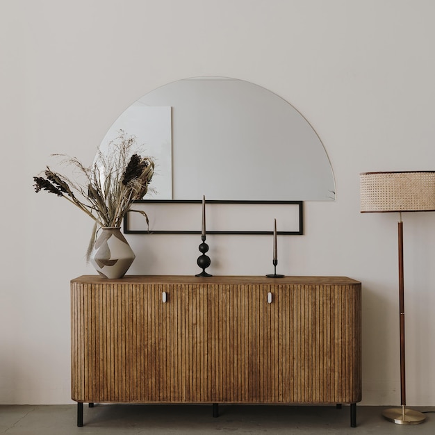 elegant stylish wooden console dried flowers bouquet candles rattan floor lamp interior decorations modern aesthetic minimalist home living room interior design luxury apartment interior