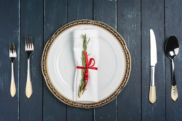 Elegant table setting with festive decor on wooden background