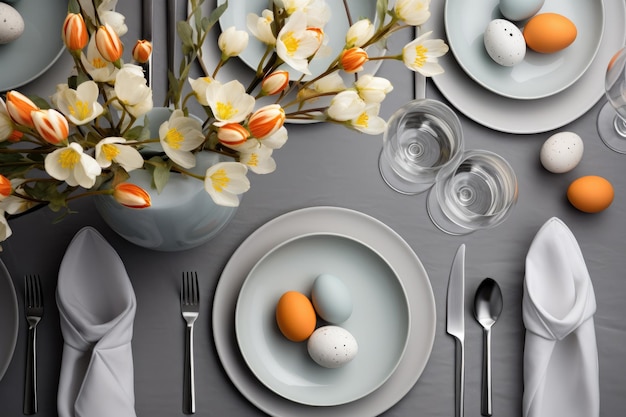 Elegant Table Setting With Plates Silverware and Flowers