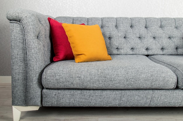 Elegant and trendy view of country styled sofa with colorful pillows